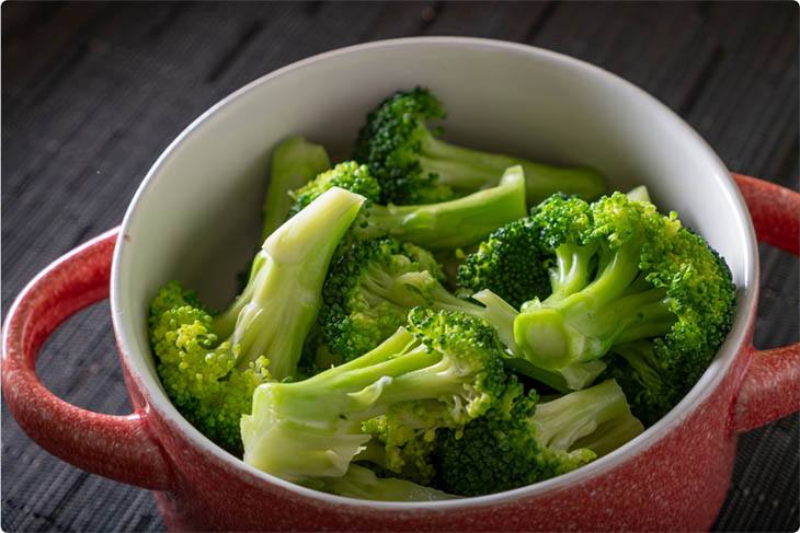 Broccoli in a pot preparing to be steamed